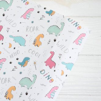 Папір подарунковий в листах 100*70 см (білий - динозаврики)